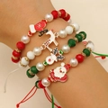Dettaglio del set di 4 braccialetti natalizi con perline e ciondoli di Babbo Natale - Regolabile 4 Pezzi (10)