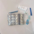 Detail of floral printed mini canvas storage pouch with soft blue patterns and zipper - Dark Blue Striped Floral