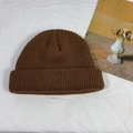 Deep brown knitted skull cap with a classic cuffed design and ribbed texture pattern - One Size / Brown