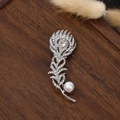 Detailed view of peacock feather brooch with sparkling zircons and a white pearl accent - 6.4x2.5cm / Feather-2 (Silver Pavé Rhinestone Pearl)