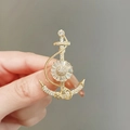 Detailed view of a gold anchor brooch with clear zircon stones on a gray background - 453# Anchor
