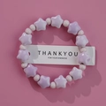 Star-shaped purple ceramic bead bracelet with pastel lavender accents on pink background - Purple Star White Round (1586-08)