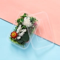 Close-up of clear B5 plastic container holding colorful dried flowers for DIY projects - Vernal Green