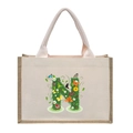 Beige canvas tote bag featuring a floral letter N print with green leaves and butterfly - Floral Letter N
