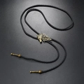Detailed close-up of bronze wolf head pendant on black braided leather bolo tie necklace - Black Wolf Head