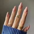 Golden signet and zircon eternity ring set on almond nude nails with blue sweater - Nude Pink (JP2138)