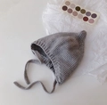 Gray knitted baby pixie hat with soft chin straps and dual pom-poms on white background - Cap circumference 40-48cm, suitable for 3-18 months / Nipple Grey