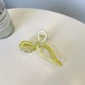 Macro shot of large lemon yellow and clear ribbon bow hair claw with gold spring - Approx. 9.5cm / Creamy Yellow + Mustard Green