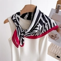 Detailed view of zebra print silk scarf with red border draped over a white top - 70x70cm / Red Edge Zebra (FJ966-1)