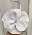 Macro shot of white 3D floral tote bag with textured petals and leather top handle - Ivory