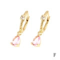Detail of gold-plated hoop earrings featuring pink pear-cut crystals and spiral texture - Pink Teardrop (ER1138)