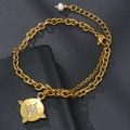 Detail of gold layered stainless steel bracelet with starburst pendant and white pearl - Gold (Eight-pointed Star/Coin)