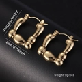 Golden bamboo design hoop earrings with textured finish and secure buckle closure - Bamboo Shape Hoop