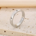 Polished silver stainless steel ring with three star-set diamonds on a stone background - Three Stone Star Style (KR1088423-YH)