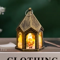 Detail of vintage bronze Christmas lantern featuring Santa Claus on a decorative book - Bronze - Santa Claus