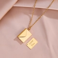 Gold envelope pendant necklace with Love You engraved card on pink silk fabric - Love You Engraved Envelope / Gold