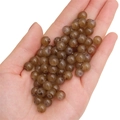 Translucent brown glass round beads held in hand for DIY handmade jewelry crafting - Deep Coffee approx 50pcs/pack