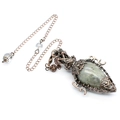 Detailed view of vintage copper hollow pendant with green crystal and matching chain - Labradorite + Pendulum Chain