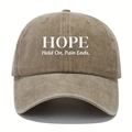 Close-up of HOPE print on washed cotton baseball cap with Hold On Pain Ends text - Khaki