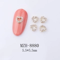Detailed view of gold alloy heart nail charms with 5.5mm size and rhinestone inlay - Gold Hollow Heart White Rhinestone (8880)