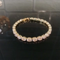 Elegant gold plated tennis bracelet with oval cut cubic zirconia stones and fold-over clasp - Gold Oval Zirconia Bracelet (F2788)