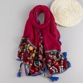 Ethnic red embroidered scarf with colorful floral patterns and blue tassel bead accents - Burgundy
