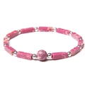 Detailed macro view of rectangular purple stone beads and silver spacers on a stylish bracelet - Emperor Stone