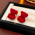 Macro shot of red flocked bear earrings placed in a premium jewelry gift box display - Silver Earring Post - Red