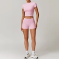 Women's pink brushed yoga set featuring high waist shorts and slim fit crop top - S / Top And Bottom / Short Sleeve + Shorts / Sakura Pink