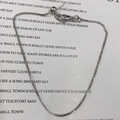 Detail of adjustable silver box chain bracelet with lobster clasp and slider bead - 0.8mm Box Chain / Silver