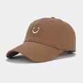 Detail of white embroidered smiley face on a brown cotton twill baseball cap fabric - Adjustable / Coffee