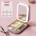 Pink portable travel makeup case with integrated LED mirror and USB charging feature - Sakura Pink