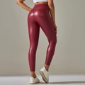 Rear view of high-waisted burgundy faux leather leggings with matte finish on model - 3XL / Burgundy