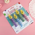 Set of 4 colorful spiral birthday candles with yellow smiley faces for party decor - Flame Smiley Candle