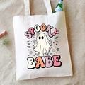 White Halloween canvas tote bag with Spooky Babe ghost print on a sandy background - Spooky Babe