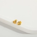Detailed shot of gold heart stud earrings with colorful cubic zirconia on white stone - Multicolor Zirconia (ES2607)