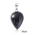 Polished black onyx teardrop pendant with silver metal clasp on white background - Black Agate