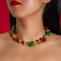 Close-up of festive colorful beaded necklace with metallic red green and gold beads - Colorful Round Beads Style