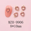 Detailed view of 8x10mm gold metal heart nail charms with pink rhinestones for Y2K style - Gold Heart Pink Rhinestone Hollow Charm (9906)