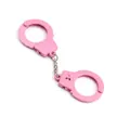 Detailed view of a mini pink toy handcuff keychain on a contrasting dark textured surface - Pink Double Handcuffs