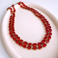 Detail of a double-layered vintage necklace with red glass beads and gold metal edges - Gold-Red