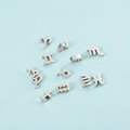 Flat lay of 12 zodiac symbol silver charms for DIY necklaces on a light blue background - Sagittarius (9#-Sagittarius) / Steel