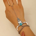 Detail of vintage bull head hand chain with turquoise inlay on a silver alloy bracelet - Turquoise Cow Skull Finger Bracelet (24 Silver 2011)
