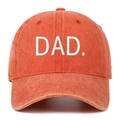 Close-up of white DAD. embroidery on a vintage washed orange cotton baseball cap - One Size / Orange