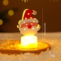 LED Christmas candle lamp featuring Santa Claus wooden cutout with warm glowing base - Santa Claus