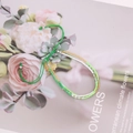 Detailed view of handmade green and white seed bead woven bracelet on floral background - Green White Gold Mixed(5#)