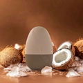 Brown and beige egg-shaped facial ice massager with streamline texture on ice background - New Egg Shape - Coffee
