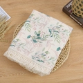 Close-up of double-layer cotton baby blanket with fringe tassels and leaf patterns - Green Plants