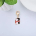 Detail of metal enamel cat pendant with heart lobster clasp on white background - Black & White Cat
