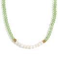 Handmade necklace with green faceted crystals, white pearls and gold beads on white background - Grass Green Transparent